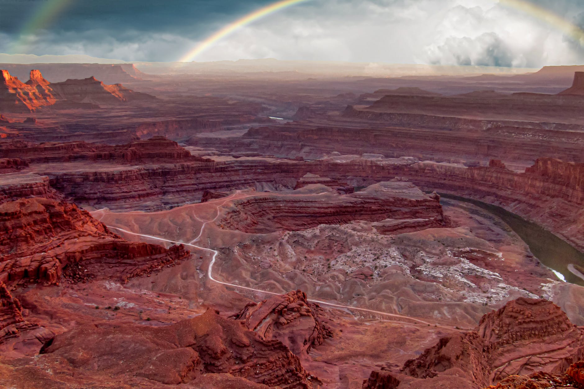 rough canyon with red soil and narrow curvy river