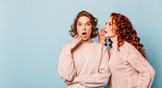 shocked-ladies-sharing-rumors-studio-shot-amazed-gossip-girls-posing-blue-background oversharing