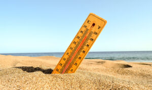 closeup-shot-thermometer-beach-sand