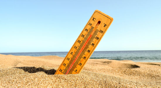 closeup-shot-thermometer-beach-sand